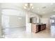 Open kitchen features a breakfast bar and views of a dining and living area with archways at 1705 Plantation Pointe Dr, Orlando, FL 32824