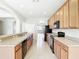 Well-equipped kitchen featuring granite countertops and dark appliances at 1705 Plantation Pointe Dr, Orlando, FL 32824