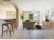 Stylishly staged living room with comfortable green sofa and views of the surrounding greenery at 1705 Plantation Pointe Dr, Orlando, FL 32824