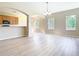 Bright living room with ample natural light from the windows, and a partial kitchen view at 1705 Plantation Pointe Dr, Orlando, FL 32824
