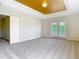 Large, carpeted main bedroom with french doors leading to outside and ensuite bathroom access at 1705 Plantation Pointe Dr, Orlando, FL 32824