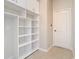 Bright mudroom features built-in shelving and a white interior door at 1705 Plantation Pointe Dr, Orlando, FL 32824