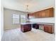 This spacious home office is filled with natural light and features custom built-in shelving and cabinetry at 1705 Plantation Pointe Dr, Orlando, FL 32824