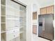 Walk-in pantry with adjustable shelving, drawers, and space for storage at 1705 Plantation Pointe Dr, Orlando, FL 32824
