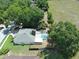 Overhead view of the home, backyard, and enclosed swimming pool at 2170 Lake Marion Dr, Apopka, FL 32712