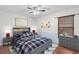 Nicely decorated bedroom with hardwood floor, ceiling fan and large window at 2170 Lake Marion Dr, Apopka, FL 32712
