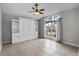 Comfortable bedroom with a murphy bed, built-in shelving, and a window with natural light at 2170 Lake Marion Dr, Apopka, FL 32712