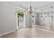 Bright dining room featuring a mirror wall, views to the outside, and tile flooring at 2170 Lake Marion Dr, Apopka, FL 32712