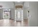 Bright foyer showcasing neutral colors, tile flooring, and a front door with sidelights at 2170 Lake Marion Dr, Apopka, FL 32712
