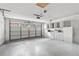 Spacious garage with white cabinets, overhead storage, and opener at 2170 Lake Marion Dr, Apopka, FL 32712