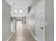 Hallway leading to a pool view with skylights and neutral paint throughout the home at 2170 Lake Marion Dr, Apopka, FL 32712