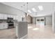 Open-concept kitchen featuring stainless steel appliances and access to the outdoor pool area at 2170 Lake Marion Dr, Apopka, FL 32712