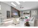 Living room with vaulted ceilings, skylights, and glass sliding doors to the pool area at 2170 Lake Marion Dr, Apopka, FL 32712