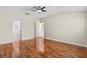 Spacious main bedroom features wood-look floors and an open doorway to the bathroom at 2170 Lake Marion Dr, Apopka, FL 32712