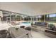 Covered patio with outdoor furniture overlooking a screened in pool at 2170 Lake Marion Dr, Apopka, FL 32712