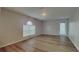 Bright bedroom featuring laminate flooring and a window at 105 Evergreen Dr, Auburndale, FL 33823