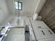 Bright, tiled bathroom featuring a sleek vanity, shower, and modern fixtures at 11757 Se 71St Terrace Rd, Belleview, FL 34420