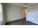 Bright bedroom with wood floors, a ceiling fan, and a spacious closet at 11757 Se 71St Terrace Rd, Belleview, FL 34420
