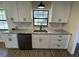 Updated kitchen featuring white cabinets, granite countertops, and stainless steel appliances at 11757 Se 71St Terrace Rd, Belleview, FL 34420