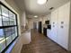 Open concept kitchen boasting granite counters, stainless appliances, and sleek white cabinetry at 11757 Se 71St Terrace Rd, Belleview, FL 34420