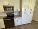 Close-up of the kitchen with stainless steel appliances, new cabinets and countertops at 11757 Se 71St Terrace Rd, Belleview, FL 34420