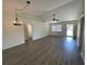 Open floor plan featuring wood flooring with a dining area and lots of natural light at 11757 Se 71St Terrace Rd, Belleview, FL 34420