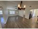 Living room features wood flooring and an open layout that connects to the kitchen at 11757 Se 71St Terrace Rd, Belleview, FL 34420