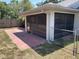 View of the outdoor patio and screened in porch with access to backyard at 11757 Se 71St Terrace Rd, Belleview, FL 34420