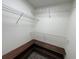 Organized walk-in closet with custom wood shelving and wire rack storage at 11757 Se 71St Terrace Rd, Belleview, FL 34420