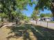 Backyard featuring a grassy area with a chain-link fence, offering a clear view of the surroundings at 1960 Hamilton St, Bartow, FL 33830