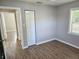 Bedroom featuring modern floors, neutral walls, and white doors and trim at 1960 Hamilton St, Bartow, FL 33830