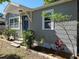 Charming single-story home with a blue front door, neat landscaping, and a welcoming facade at 1960 Hamilton St, Bartow, FL 33830