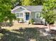 Charming single-story home with a blue front door and well-maintained landscaping at 1960 Hamilton St, Bartow, FL 33830