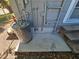 The exterior of the home features an older water heater and piping at 1960 Hamilton St, Bartow, FL 33830