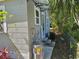 The exterior of the home features an air conditioning unit and a newer water heater at 1960 Hamilton St, Bartow, FL 33830