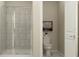 This bathroom boasts a walk-in shower with tiled walls and a separate toilet room for added privacy at 2934 Haze Rd, Clermont, FL 34714