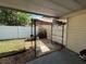 Gazebo and grill in backyard with privacy fence and green lawn at 3210 Se 54Th Cir, Ocala, FL 34480
