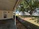 Backyard with patio, storage shed, large tree, and white privacy fence at 3210 Se 54Th Cir, Ocala, FL 34480