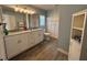 Bathroom with double sinks, storage and modern lighting at 3210 Se 54Th Cir, Ocala, FL 34480
