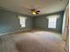 Bright and spacious bedroom featuring natural light from two windows and neutral-toned walls at 3210 Se 54Th Cir, Ocala, FL 34480