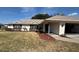 Charming single-story home featuring a well-manicured lawn and lovely landscaping at 3210 Se 54Th Cir, Ocala, FL 34480