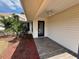 Inviting front porch with ceiling fan and decorative blue front door at 3210 Se 54Th Cir, Ocala, FL 34480