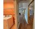 Hallway with view to the laundry room, living room and adjacent rooms at 3210 Se 54Th Cir, Ocala, FL 34480