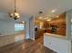 Open concept kitchen with stainless steel appliances, wood cabinets, and adjacent dining area at 3210 Se 54Th Cir, Ocala, FL 34480
