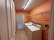 Laundry room with washer, dryer, shelving, tile floor and access to backyard at 3210 Se 54Th Cir, Ocala, FL 34480