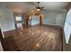 Open-concept living room showcasing modern flooring, fireplace, and an abundance of natural light at 3210 Se 54Th Cir, Ocala, FL 34480
