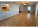 Living room with tile floors, natural light, and access to the kitchen and another room at 3210 Se 54Th Cir, Ocala, FL 34480
