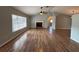 Spacious living room with brick fireplace and large window with natural light at 3210 Se 54Th Cir, Ocala, FL 34480