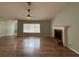 Living area featuring fireplace and window providing ample natural light, wood look floors at 3210 Se 54Th Cir, Ocala, FL 34480