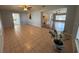 Open-concept living room with tile flooring, a ceiling fan and lots of natural light at 3210 Se 54Th Cir, Ocala, FL 34480